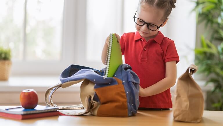 a responsible child preparing to school